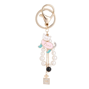 Creative gold kitten keychain with pink cat charm, white pearls and perfume bottle pendant