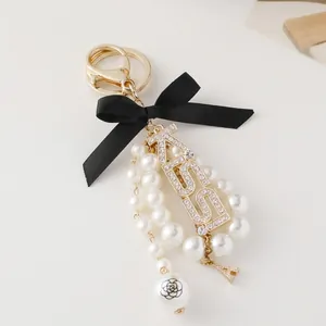 Portachiavi KISS con Fiocco in Satin e Künstliche Perle Sintetiche Stile Francese Elegante Ciondolo per Borsa Lettere Strass Oro Metallo