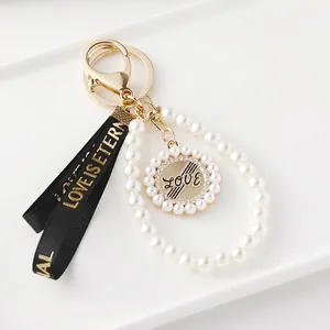 Porte-Clés Élégant à Nœud en Künstliche Perles pour Femmes Pendentif Love en Alliage Bijou de Sac avec Strass Doré Accessoire de Mode