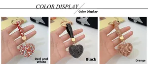 Detailed view of heart-shaped crystal keychains in red, black and champagne gold
