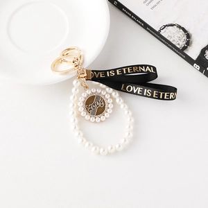 Porte-clés perle élégant avec pendentif disque doré LOVE pour sacs à main et clés de voiture