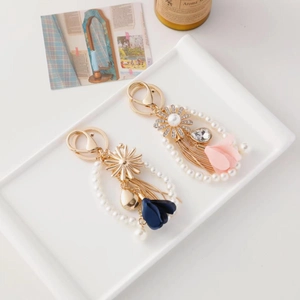 Elegant floral tassel keychain with sunflower rhinestone and white pearls for bags