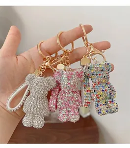 Detailed view of handmade rhinestone bear keychains in pink, silver and multicolor