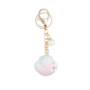 Porte-clés coquillage dégradé avec perle blanche et étoiles dorées pour accessoires de sac