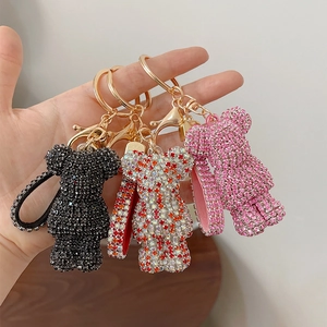 Three sparkling rhinestone bear keychains in black, pink, and multicolored crystal sets