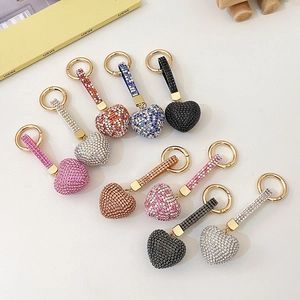 Sparkling heart-shaped rhinestone keychains in multiple colors with golden metal rings