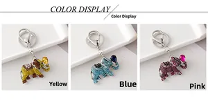 Detailed macro view of three crystal elephant keychains in yellow blue and pink colors