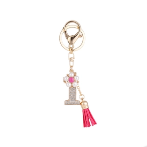 Porte-clés fait main en or avec pendentif fleur, chiffre 1 en cristal et gland rose