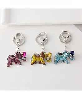 Detail showing elephant keychains with colorful rhinestones and teardrop gemstones