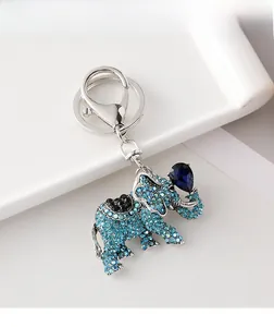 Close-up of elephant keychain with light blue rhinestones and pear-cut blue gemstone