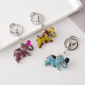 Cartoon elephant keychain set with rhinestones in purple, yellow, and blue colors