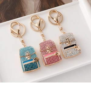 Detailed macro view of heart backpack keychains with sparkling rhinestones in three colors