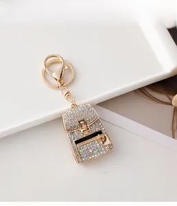 Detailed macro view of the sparkling backpack keychain with colorful crystal diamonds