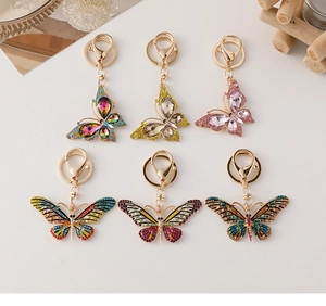 Détails de porte-clés papillon colorés avec des strass étincelants et alliage doré de luxe