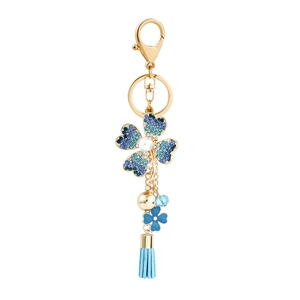 Sparkling blue crystal flower keychain with elegant gold metal tassel and soft fabric fringe
