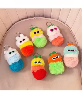 Detail of colorful plush caterpillar keychains with sunglasses and metallic rings