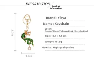 Detailed view of green Chinese dragon keychain with rhinestones and alloy coin charm