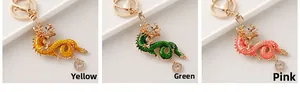 Three Chinese dragon keychains in yellow, green and pink with sparkling crystal rhinestones