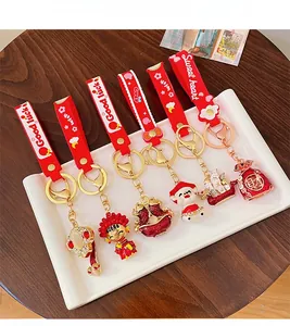 Set of six festive Chinese New Year keychains with golden lucky charms and red straps