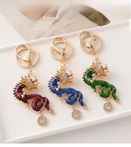 Detailed macro view of Chinese dragon keychains with colorful enamel and inlaid rhinestones
