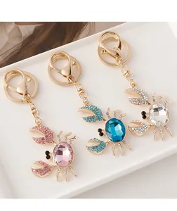 Détails des porte-clés crabe en rose, bleu et transparent avec strass en cristal brillant
