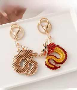 Detail of dragon keychains featuring gold hollow mesh and colorful enamel craftsmanship