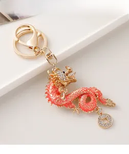 Macro view of Chinese dragon keychain with red enamel and inlaid sparkling rhinestones