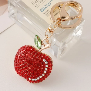 Red sparkling rhinestone apple keychain with gold alloy base and green crystal leaf charm