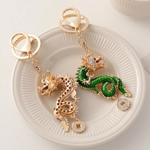 Exquisite Chinese zodiac dragon keychain set in gold and green enamel with sparkling rhinestones