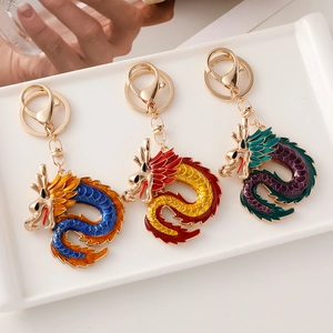 Three colorful Chinese zodiac dragon keychains with enamel oil dripping and gold clasps