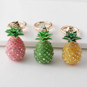 Sparkling pineapple keychains with crystal rhinestones in pink, green, and yellow gold finish