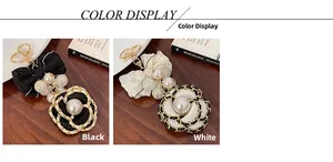 Detail of camellia floral keychains with lace bows and pearl beads in black and white