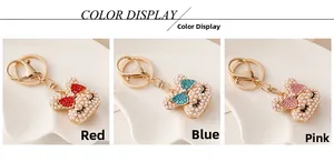 Detailed view of cute bear keychains with pearls and rhinestones in three colors