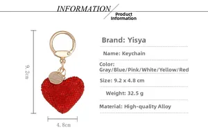 Detail view of red rhinestone heart keychain with gold alloy hook and size measurements