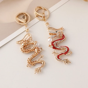 Porte-clés dragon du zodiaque chinois doré serti de strass brillants et de perles blanches