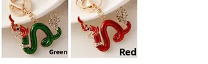 Detail view showing green and red dragon keychains with shiny white rhinestones