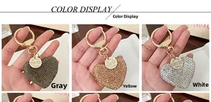 Close-up of sparkling heart keychains in grey, gold, and white rhinestone options