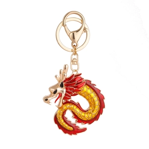Exquisite golden Chinese dragon keychain with red and yellow enamel details for bags