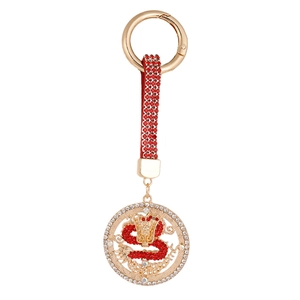 Golden dragon keychain pendant with sparkling red crystals and zodiac pattern charm