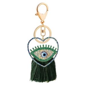 Porte-clés cœur œil maléfique doré avec strass bleus et pompon en soie vert foncé élégant