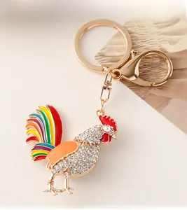 Detail of colorful crystal rooster keychain with rainbow feathers and lobster clasp