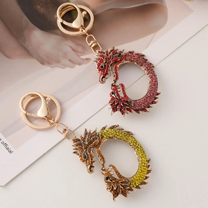 Porte-clés dragon exquis avec strass étincelants en dégradé de couleur or et rose