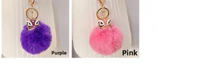 Détail des porte-clés danse du lion en peluche violet et rose avec cristaux étincelants