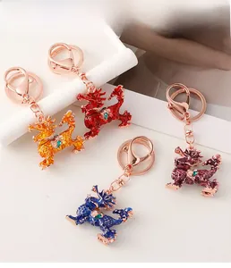 Detailed close-up of colorful enamel Kirin keychains in four colors with rose gold finish
