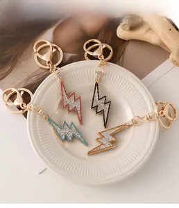 Macro shot of hip hop lightning keychains with zircon inlays in four vibrant colors