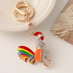 Colorful rooster keychain with rhinestones and rainbow enamel on a golden metal base