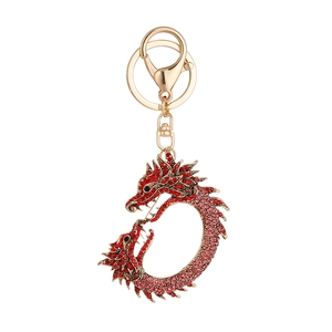 Porte-clés dragon doré orné de strass dégradés rouges et roses avec boucle en métal