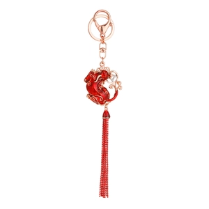Traditional Chinese red tassel keychain with lucky beast pendant and rose gold trim