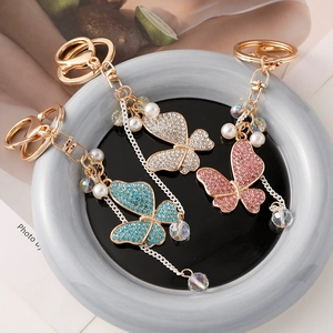 Exquisite crystal butterfly keychain with pearls and tassels in blue white and pink