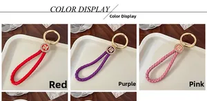 Detail of woven leather keychain with diamond metal tag and Chinese lucky characters